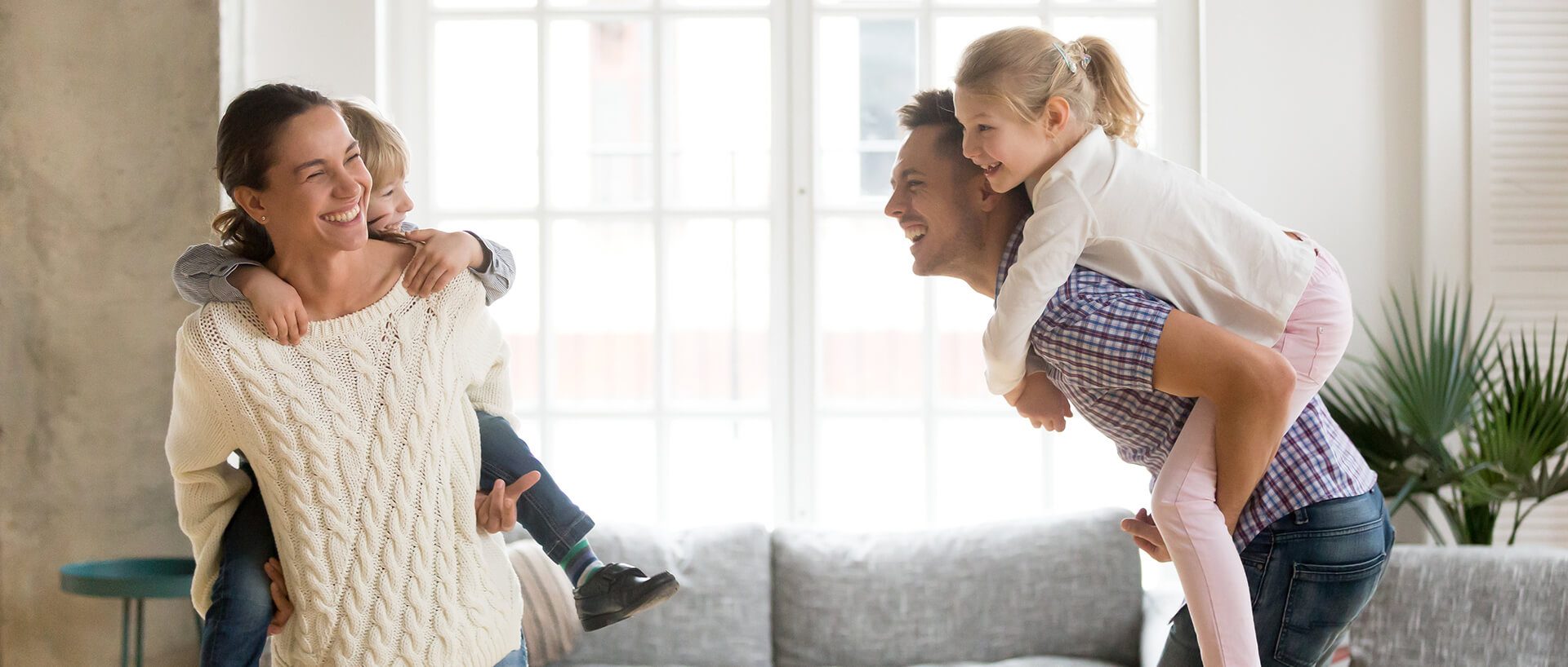 Family playing with nice windows in the background